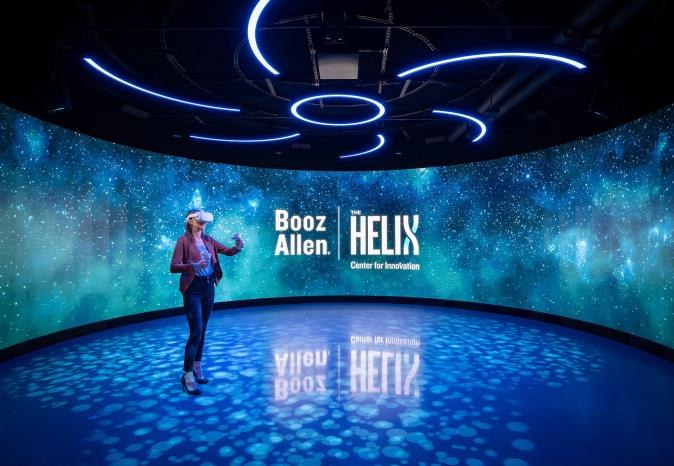 A visitor inside the immersive projection room at The Helix